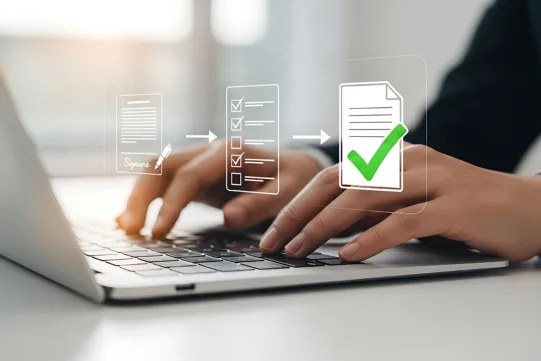 Hands typing on a laptop keyboard with digital icons of documents, checklists, and green check marks superimposed, symbolizing online document approval or workflow.