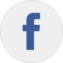 A blue lowercase letter “f” on a white circular background, representing the Facebook logo.